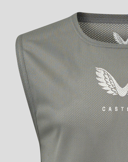 Close-up of Sharkskin junior training bib fabric showing scoop neckline and Castore logo.