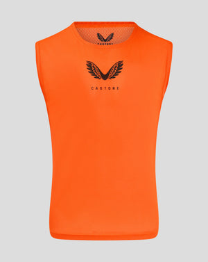 Front view of bright orange junior training bib with Castore logo on chest