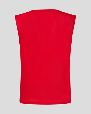 Back view of red junior training bib showing perforated mesh fabric.