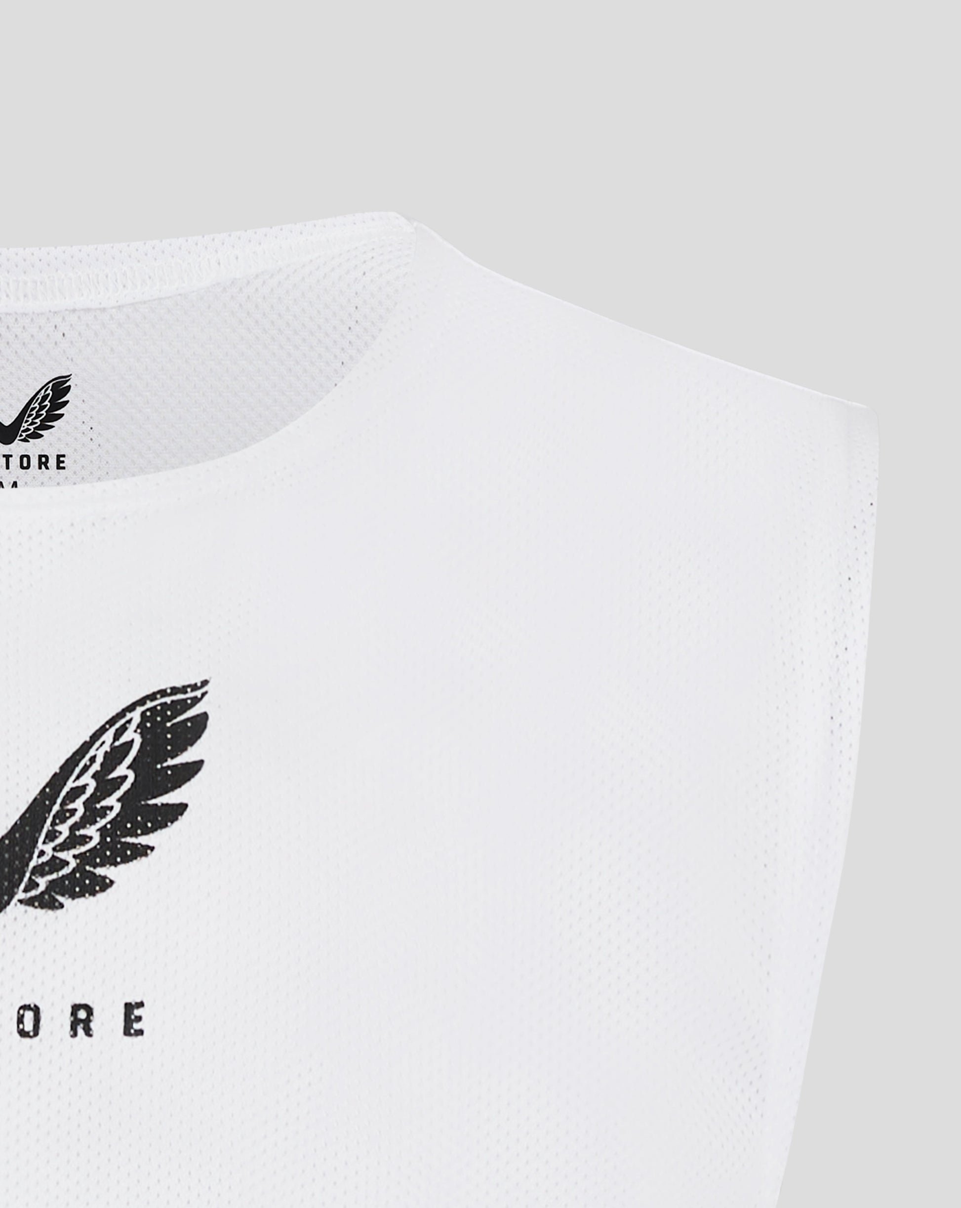 White unisex training bib with scoop neckline and armhole binding and Castore logo