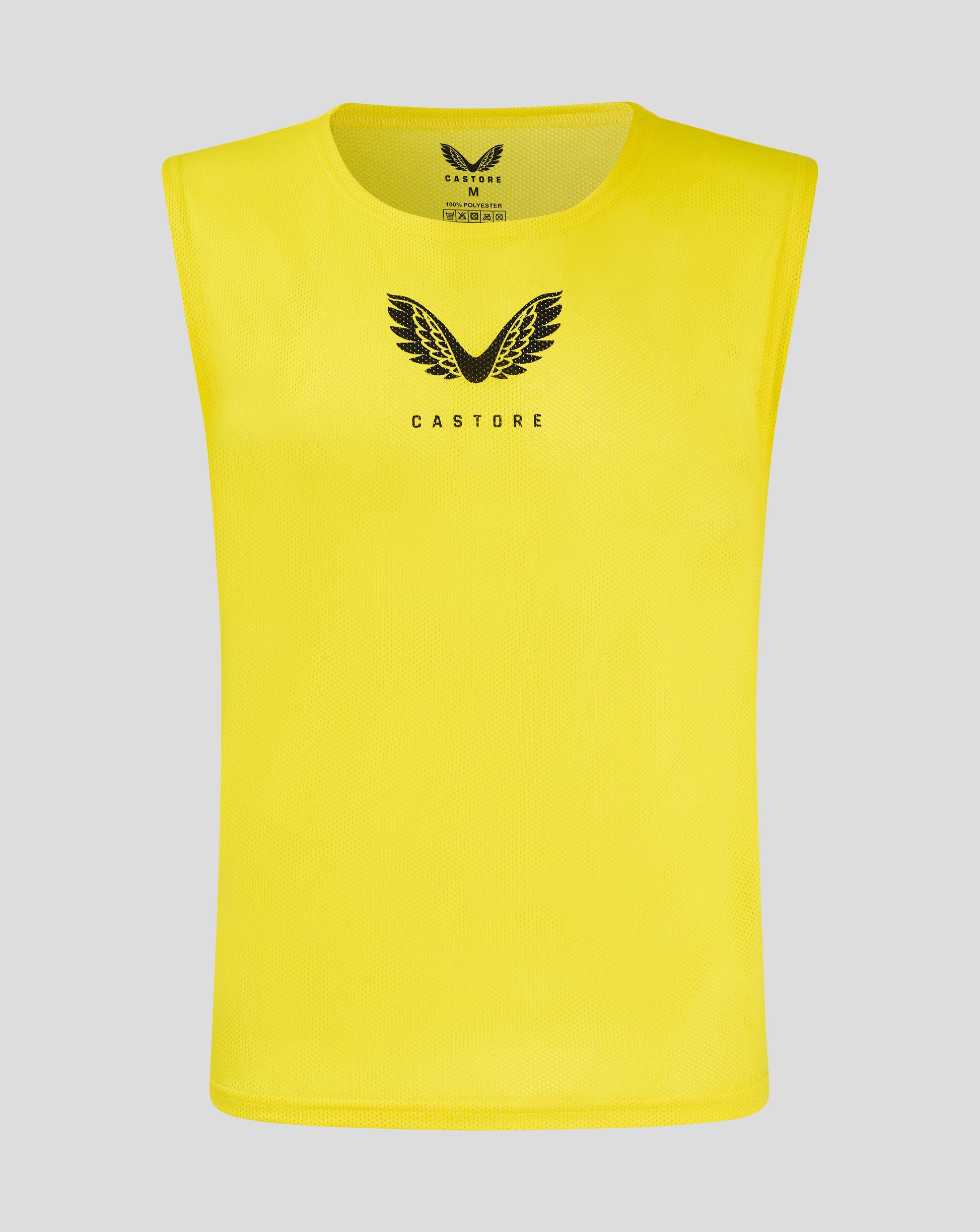 Yellow junior training bib with scoop neckline and Castore logo on front