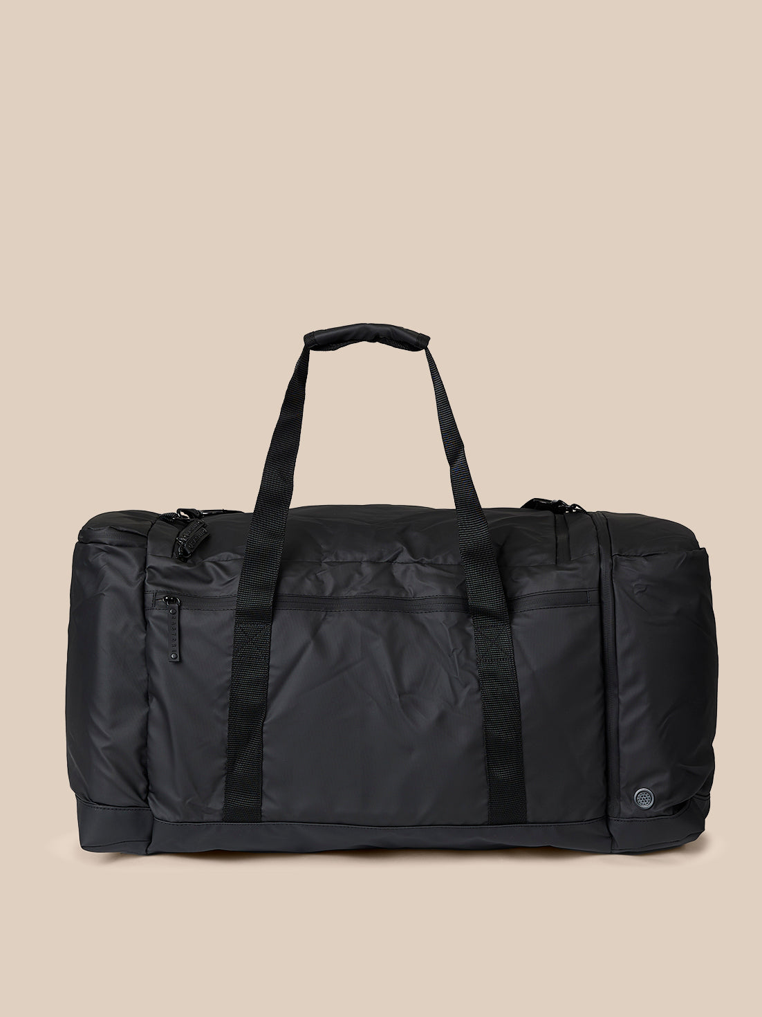 Side view of black holdall with top handles and vertical webbing straps
