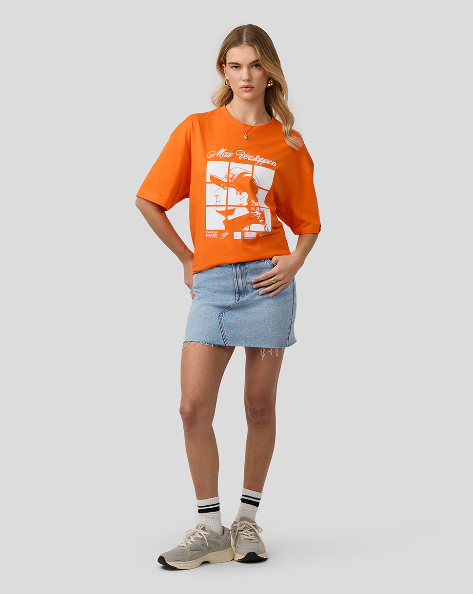 Female model wearing bright orange Max Verstappen Puzzle T shirt with oversized fit and bold front graphic.