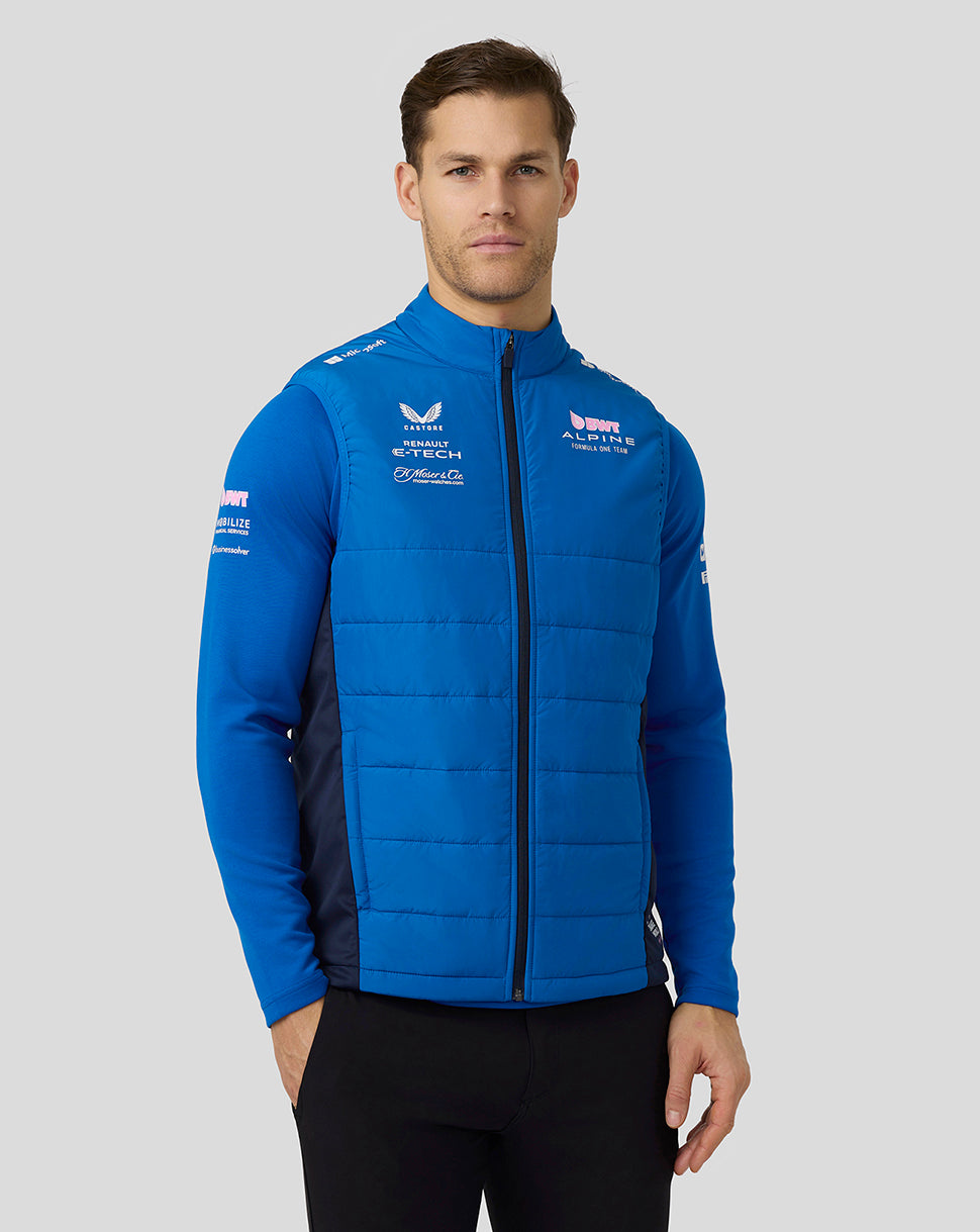 Male model wearing lapis blue Alpine Formula One Team Hybrid Gilet with quilted panels and zip front