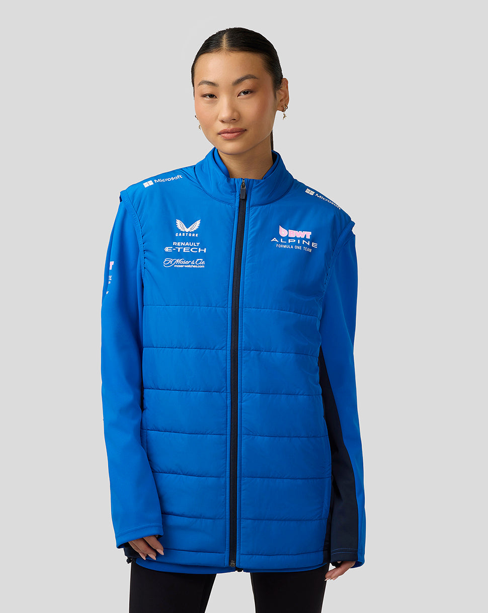 Front view of a model wearing lapis blue Alpine Formula One Team Hybrid Gilet with padded quilting and full zip.
