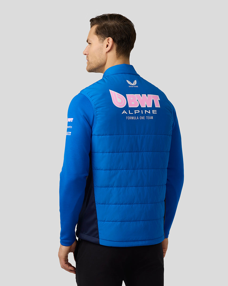 Back view of a blue Alpine Formula One Team Hybrid Gilet showing a large BWT Alpine logo on the back.