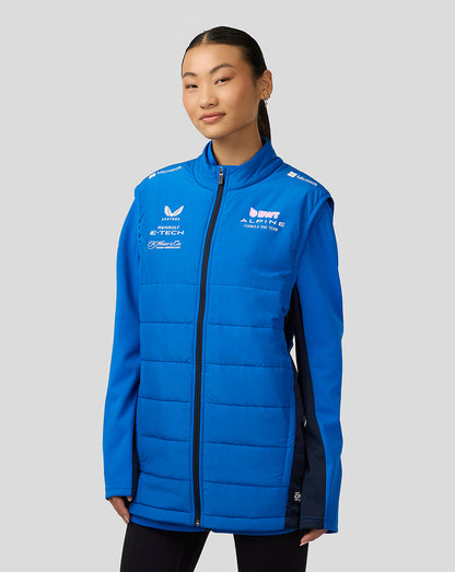 Young woman wearing blue BWT Alpine Formula One Team hoodie with chest logos and zip front