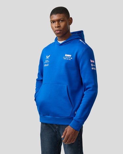 Male model wearing lapis blue BWT Alpine unisex pullover hoodie with white team logos on chest.