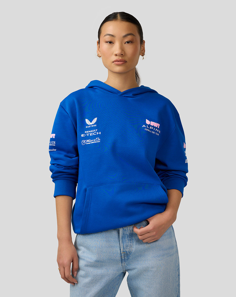 Female model in lapis blue BWT Alpine hoodie front view with chest branding.