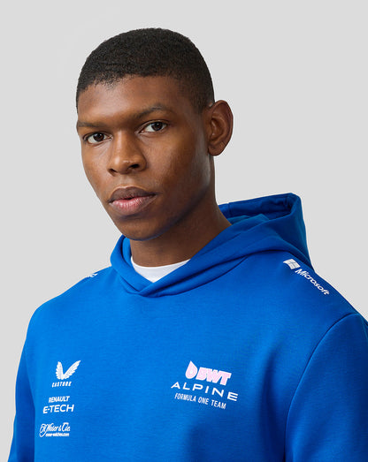 Male model wearing lapis blue BWT Alpine Formula One Team hoodie with chest logos visible