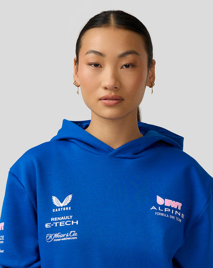 Female model in a lapis blue BWT Alpine Formula One Team hoodie, chest and sleeve logos visible
