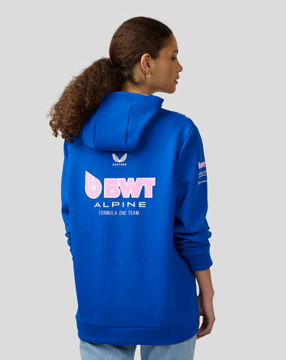 Back view of a model wearing a lapis blue BWT Alpine Formula One Team full zip hoodie with a large back logo