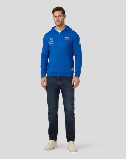 Male model wearing a lapis blue BWT Alpine Formula One Team full zip hoodie with zip front and chest logos