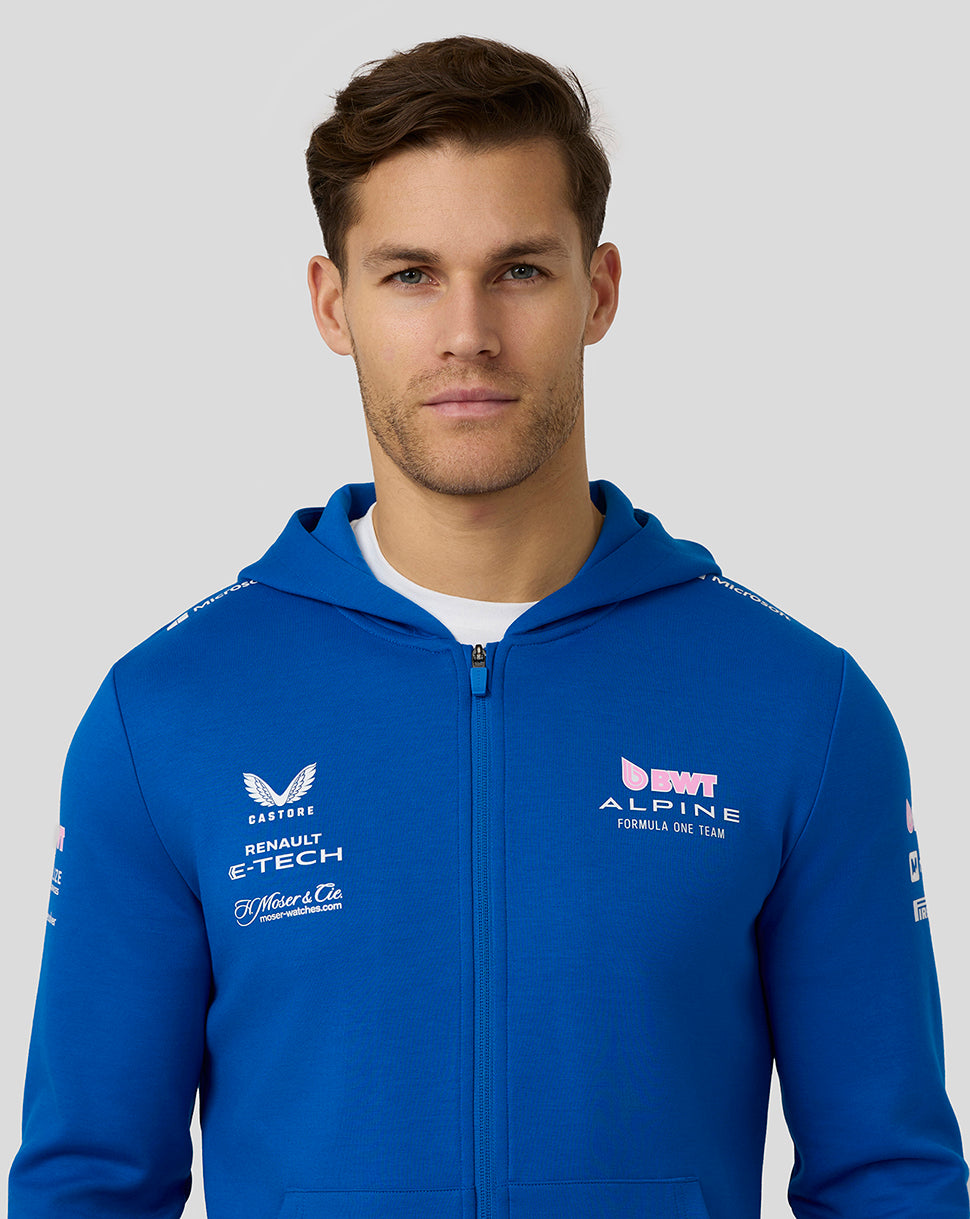 Male model wearing lapis blue BWT Alpine full zip hoodie with chest logos and patch pockets