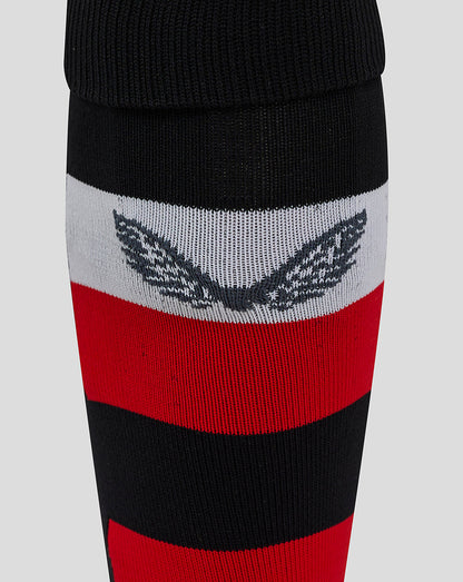 Ulster home socks close up showing black cuff white and red stripes with a wing crest.