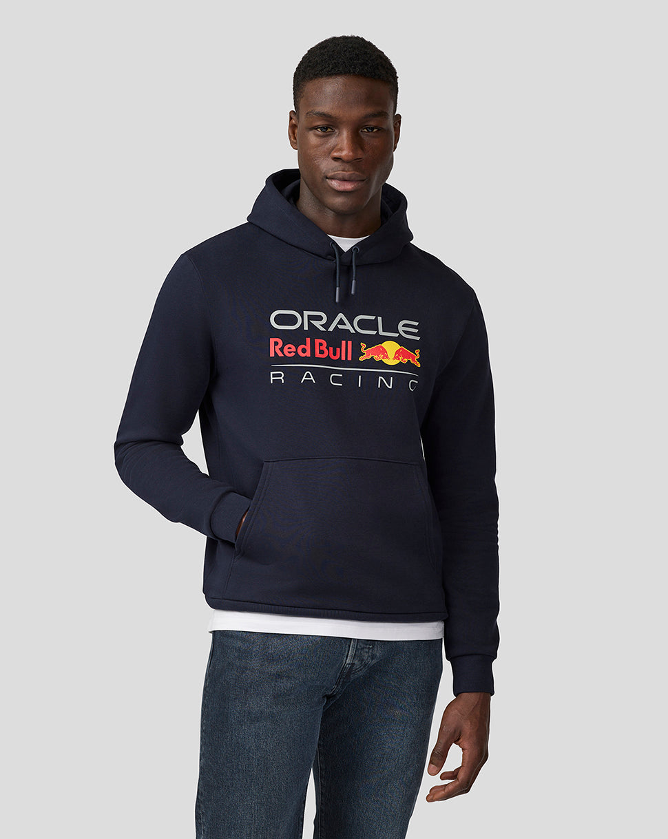 Front view of a man in a navy Oracle Red Bull Racing hoodie with a bold chest graphic and kangaroo pocket