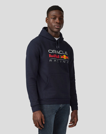 Male model wearing a navy Night Sky Oracle Red Bull Racing hoodie with front logo and kangaroo pocket