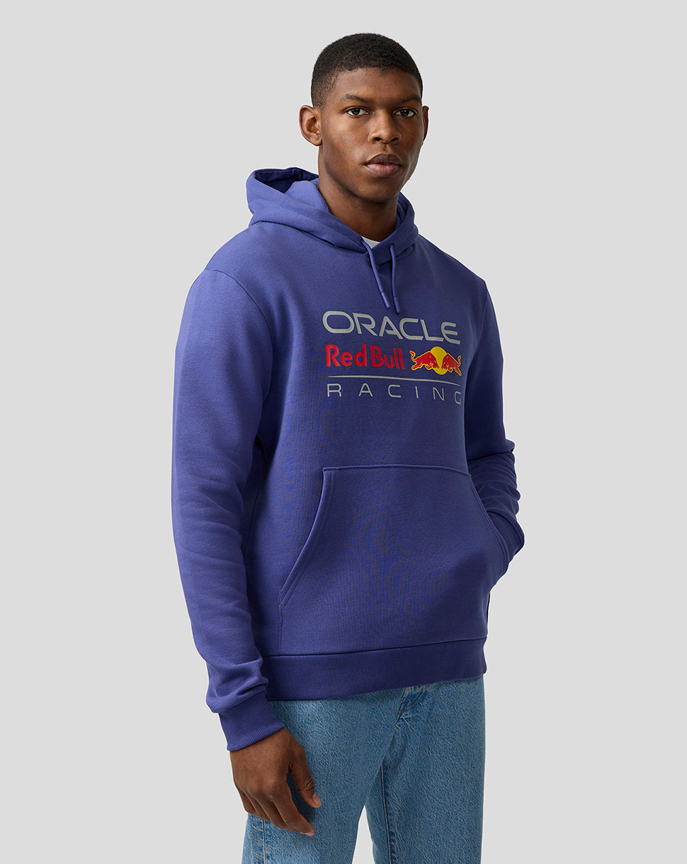 Male model in Skipper Blue Oracle Red Bull Racing hoodie with front logo and drawstring hood.