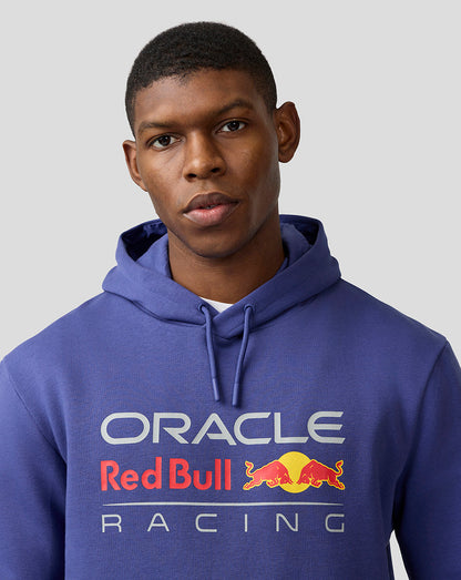 Male model wearing Skipper Blue Oracle Red Bull Racing hoodie with large front logo and kangaroo pocket.
