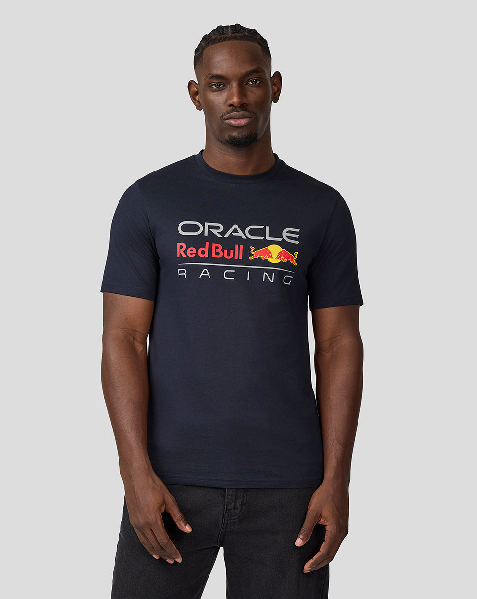 Man wearing navy blue Oracle Red Bull Racing T shirt with a large front logo.