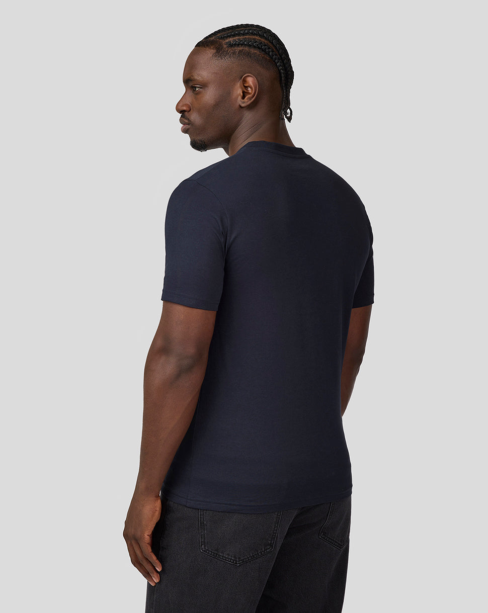Back view of a man in a navy Oracle Red Bull Racing T Shirt with short sleeves