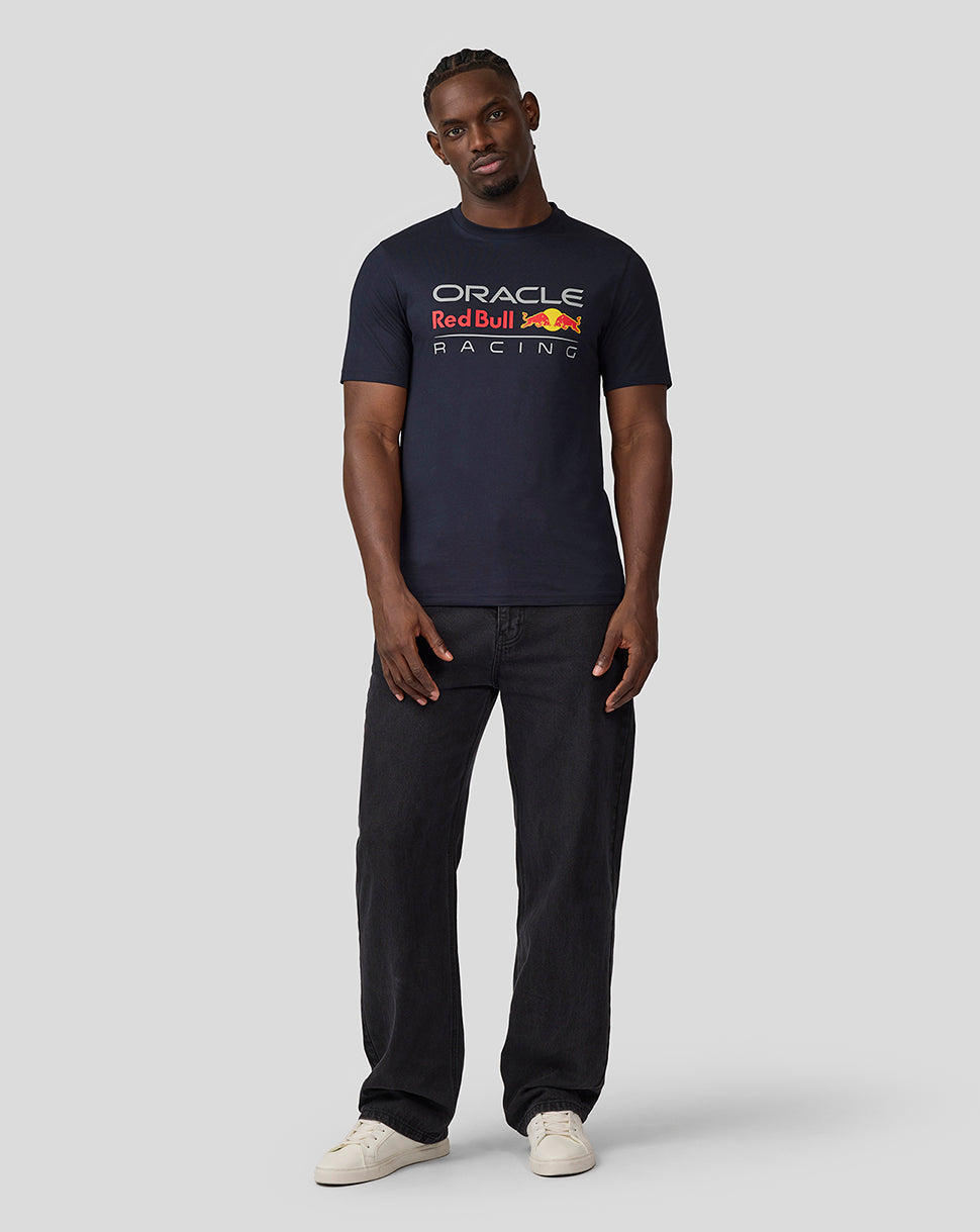 Front view of a man in navy Oracle Red Bull Racing T Shirt with large graphic on chest