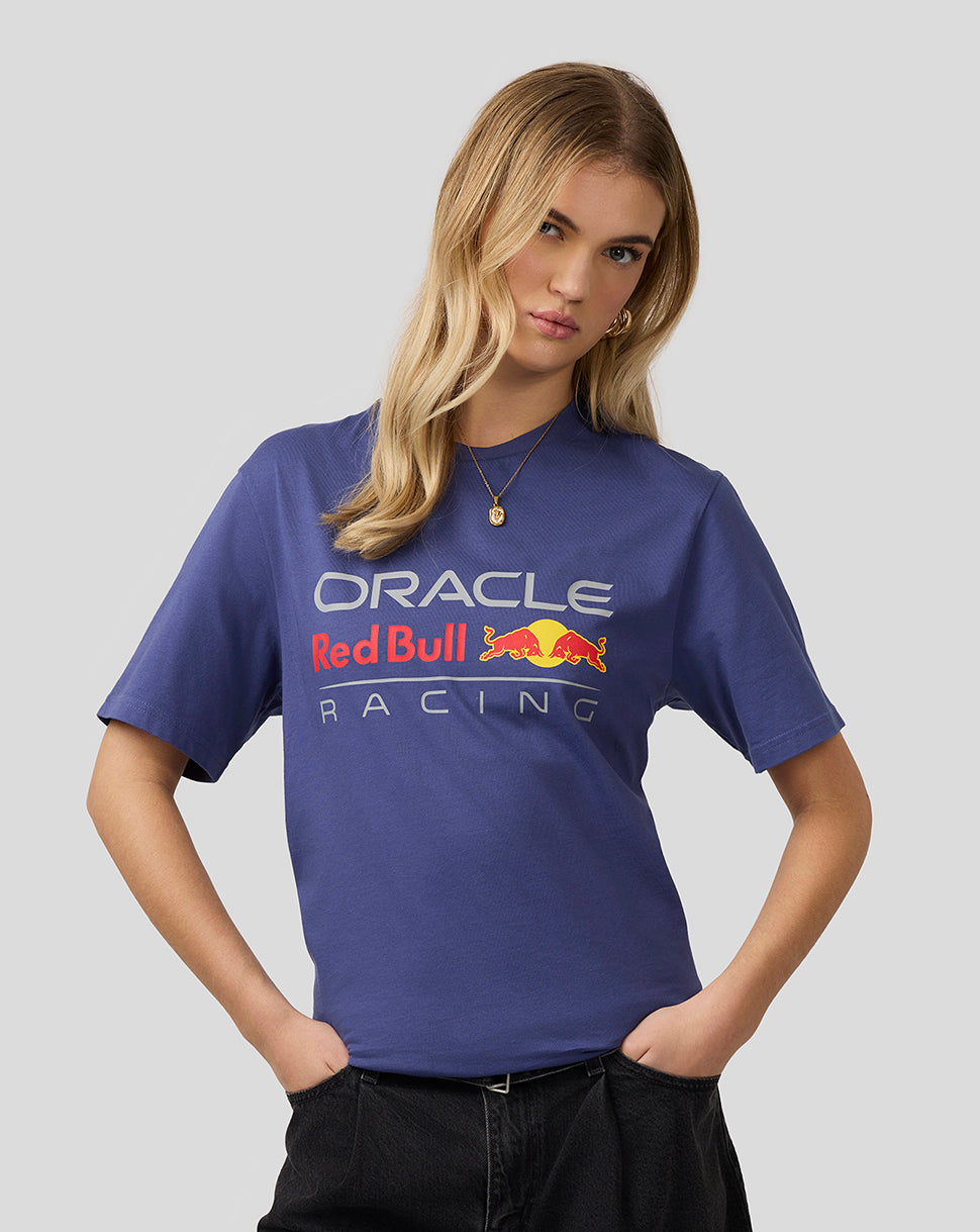 Front view of a woman wearing a blue Oracle Red Bull Racing T-shirt with large front graphic