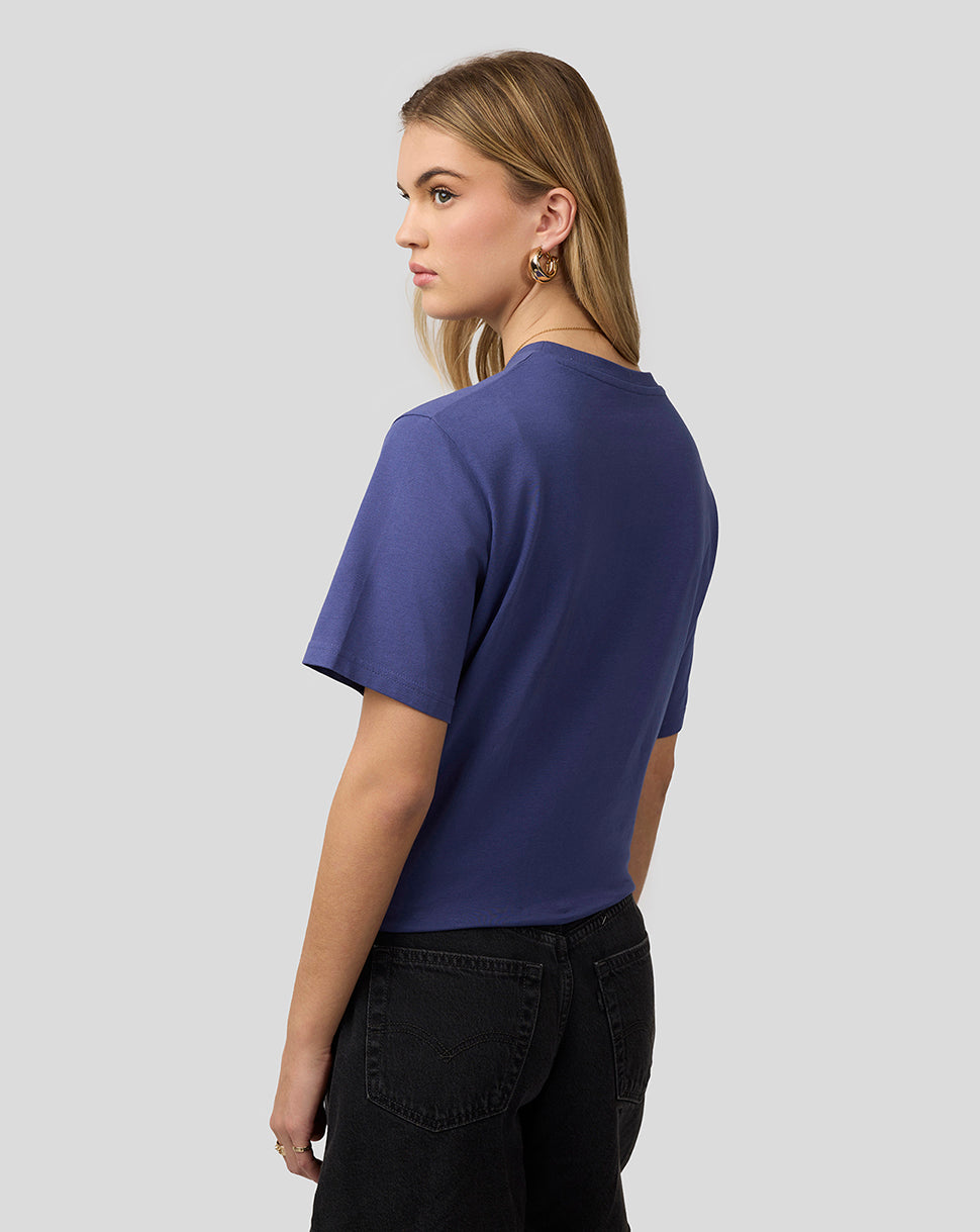 Back view of a blue Oracle Red Bull Racing T-shirt worn by a woman