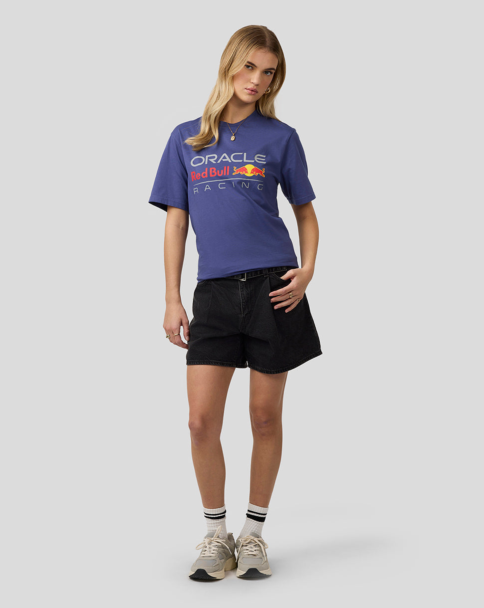 Female model wearing blue Oracle Red Bull Racing T-shirt with large front logo.