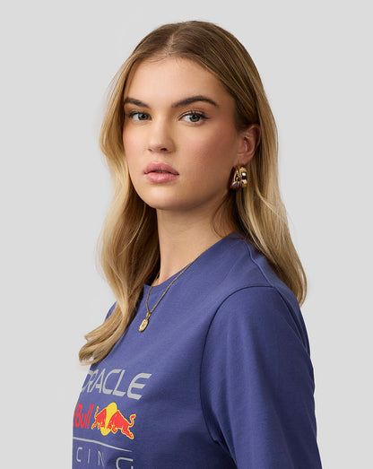 Female model in blue Oracle Red Bull Racing T-shirt with a large front logo.