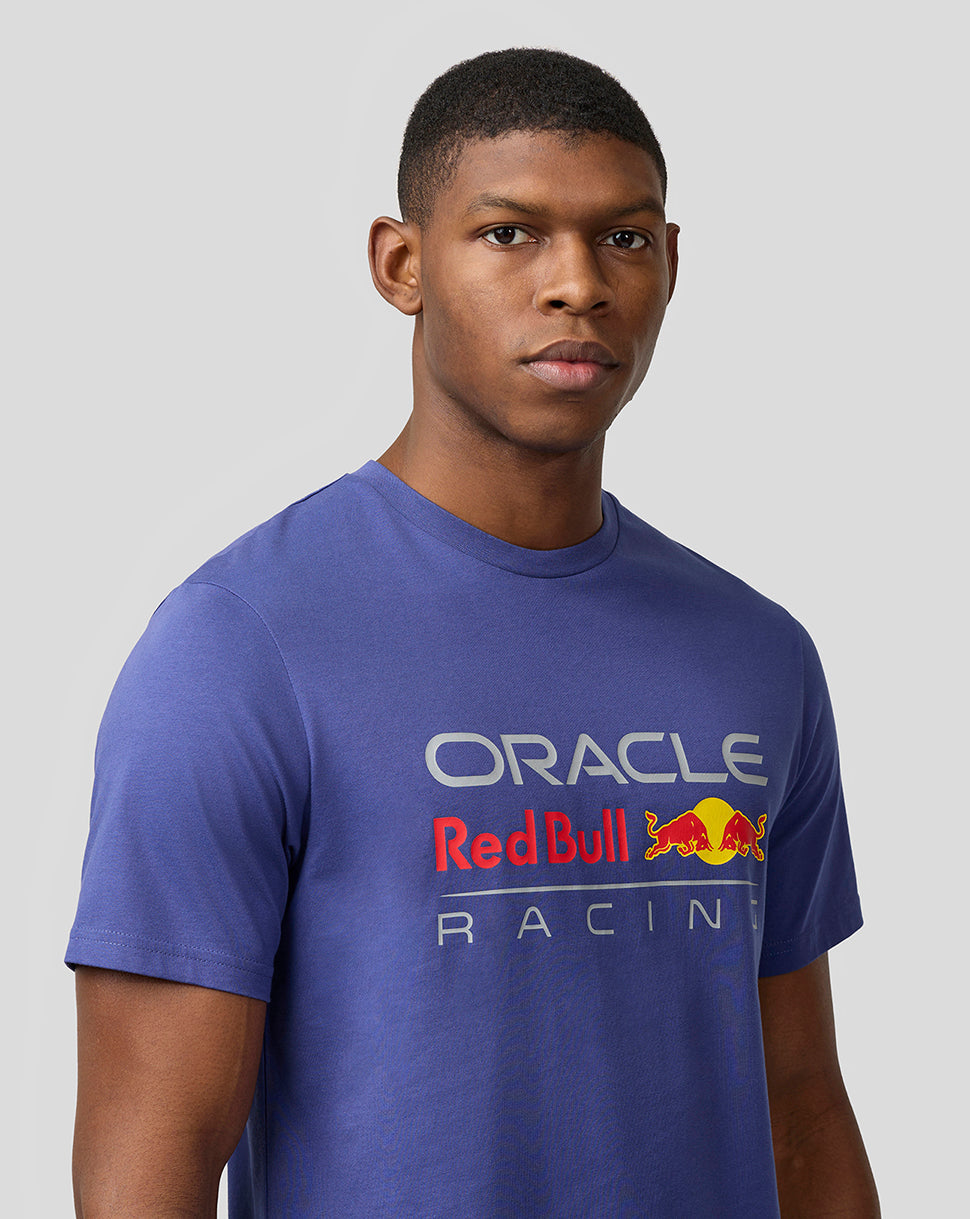 Male model wearing a skipper blue Oracle Red Bull Racing T-shirt with a large front logo.
