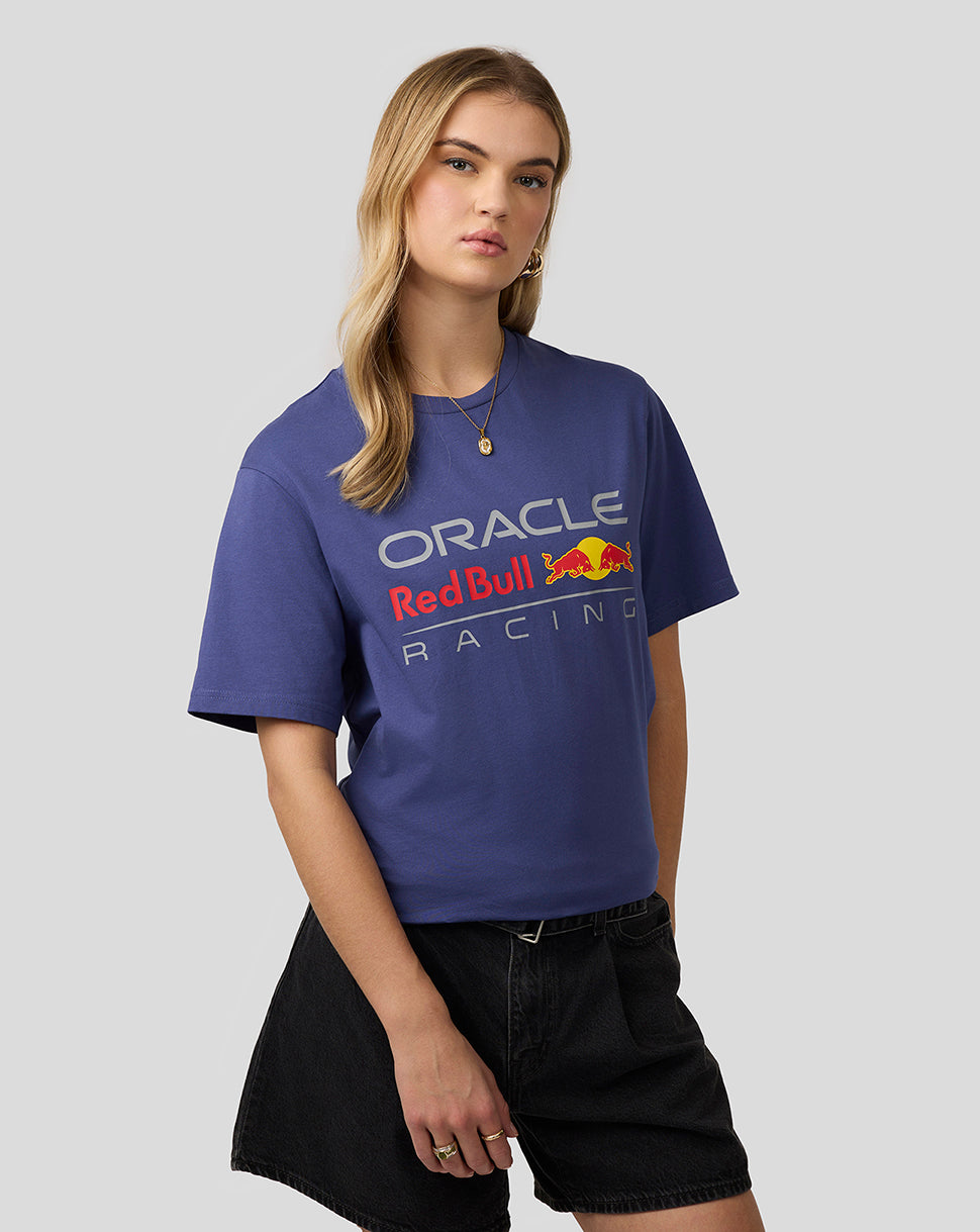 Female model in a Skipper Blue Oracle Red Bull Racing T Shirt with a bold front graphic.