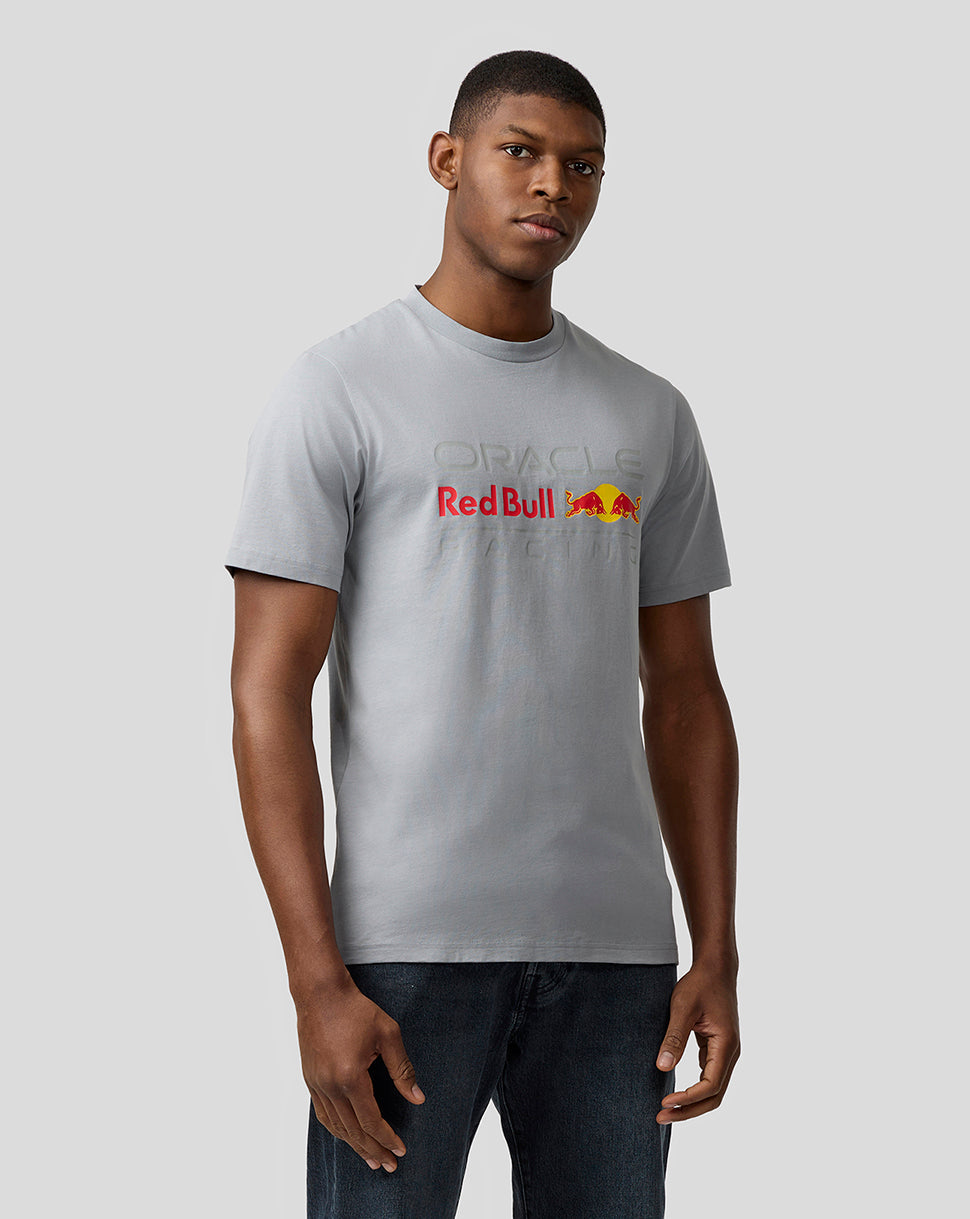 Front view of a man wearing a light gray Oracle Red Bull Racing Core T-shirt with a large Red Bull graphic on the chest