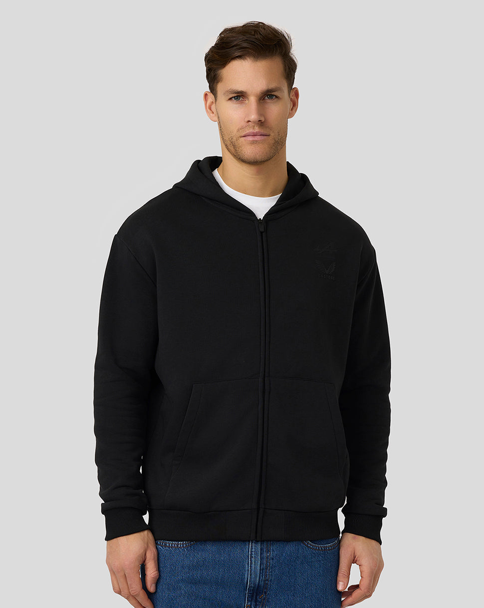 Male model in black Alpine Formula One Team zip hoodie with front pockets and hood.