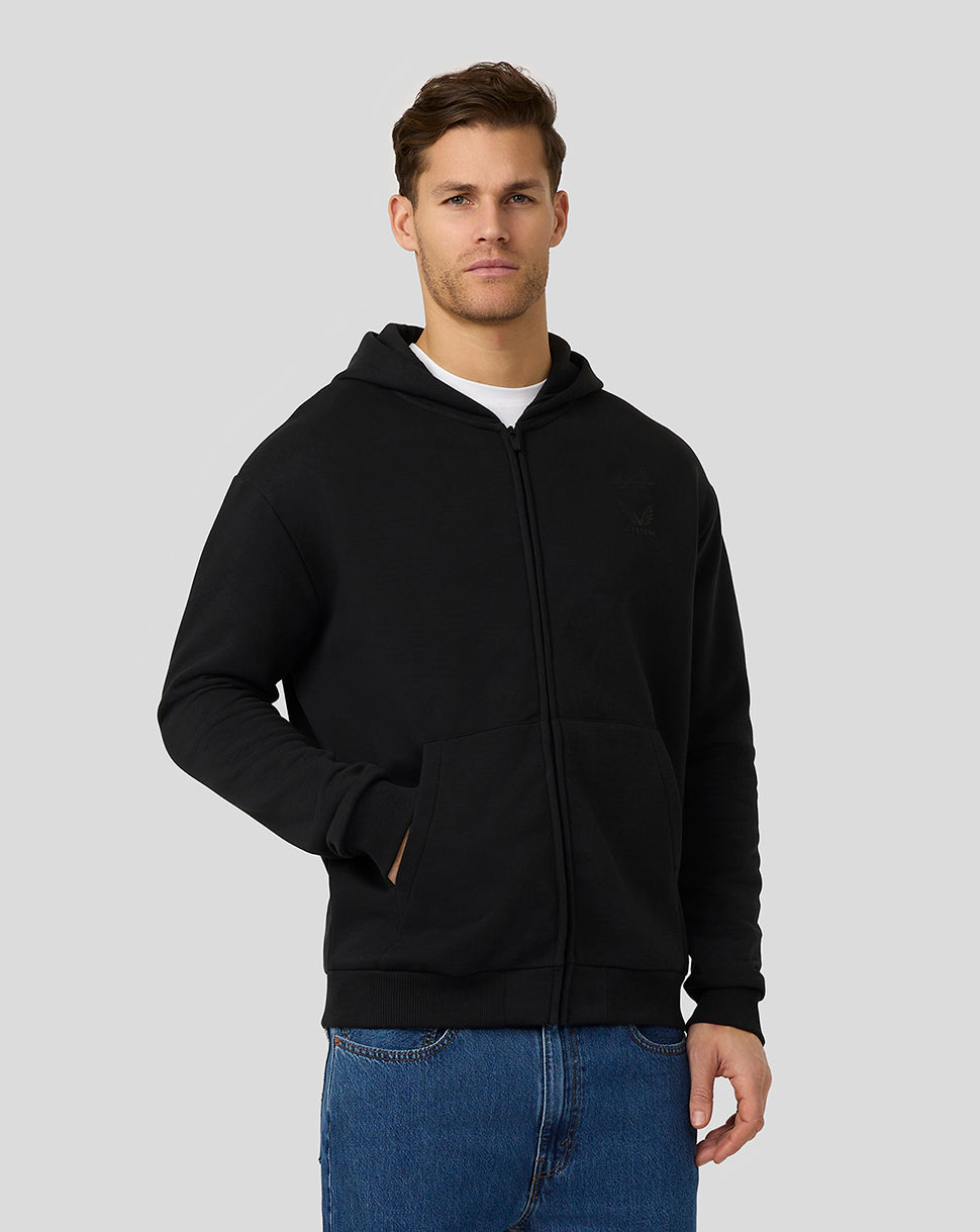 Male model wearing BWT Alpine Formula One Team black on black zipped hoodie with front pockets