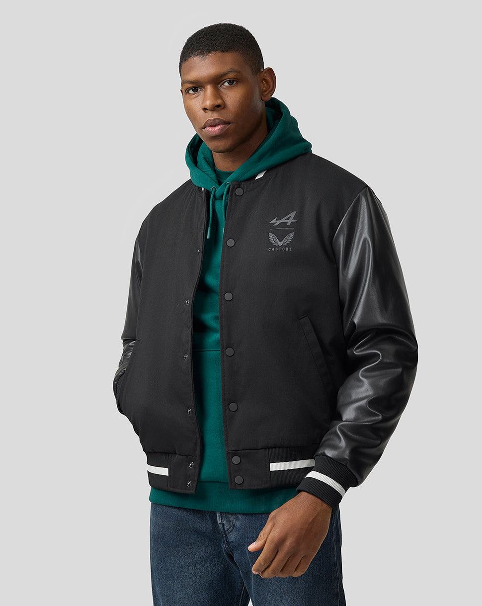 Male model wearing a black bomber jacket with leather sleeves from the BWT Alpine Formula One Team collection