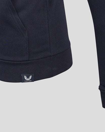 Detail of navy Sergio Perez hoodie hem showing the kangaroo pocket and Castore label
