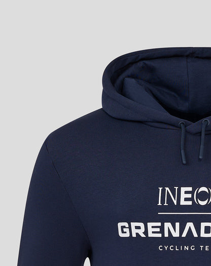 Close-up of navy hoodie showing hood with drawstrings and front INEOS Grenadiers logo.