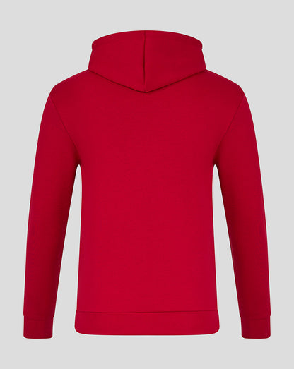 Back view of red INEOS Grenadiers unisex hoodie with hood up and minimal seams.