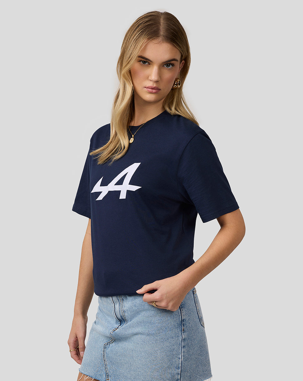 Model wearing navy Alpine Core Essentials T-Shirt with a large white front graphic.