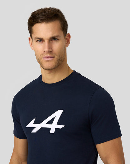Male model wearing navy Alpine Core Essentials T-shirt with a bold white logo on the chest.
