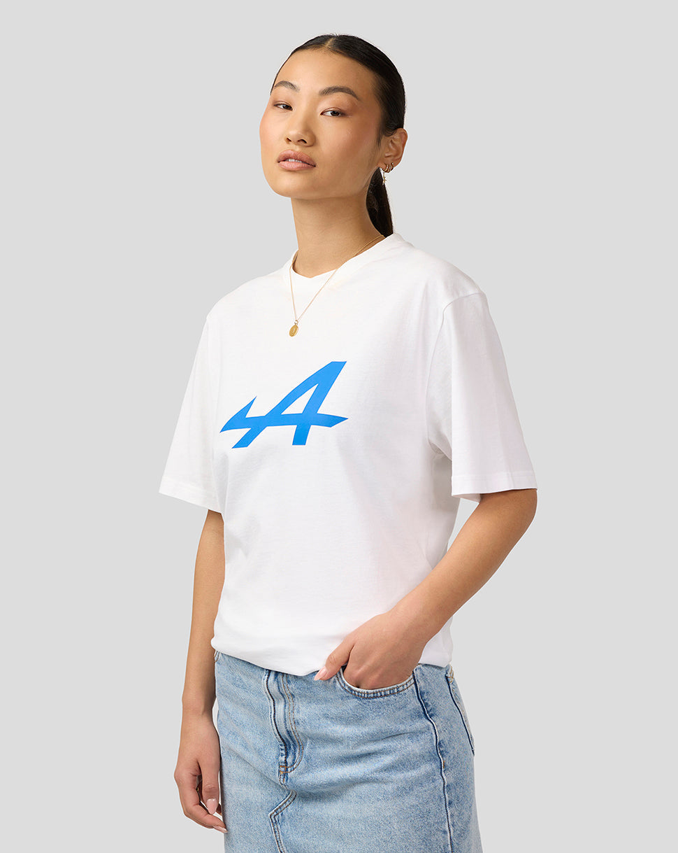 Woman wearing white Alpine Core Essentials T-Shirt with large blue logo on the front