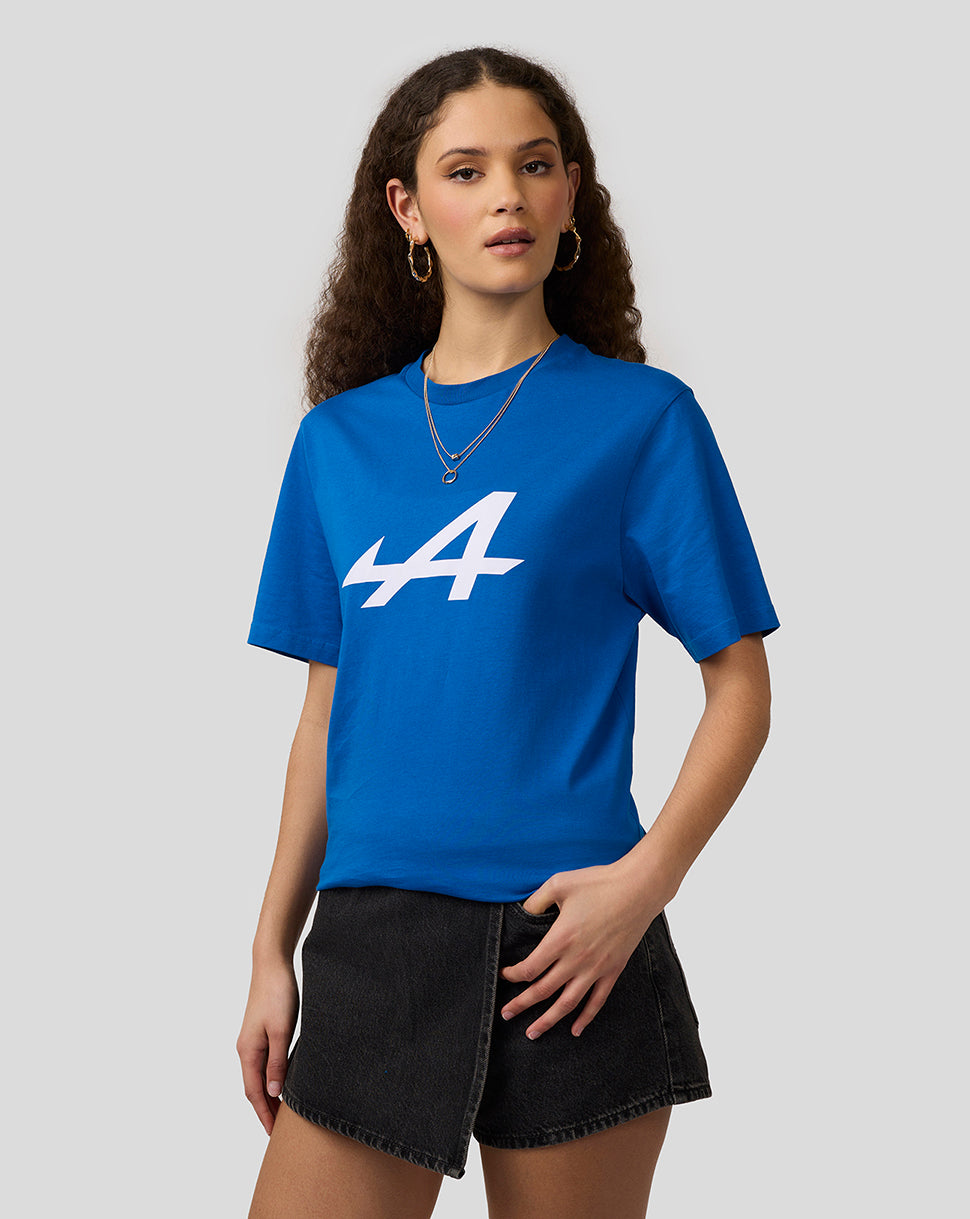 Female model in lapis blue Alpine Core Essentials T-Shirt with white logo on the chest.