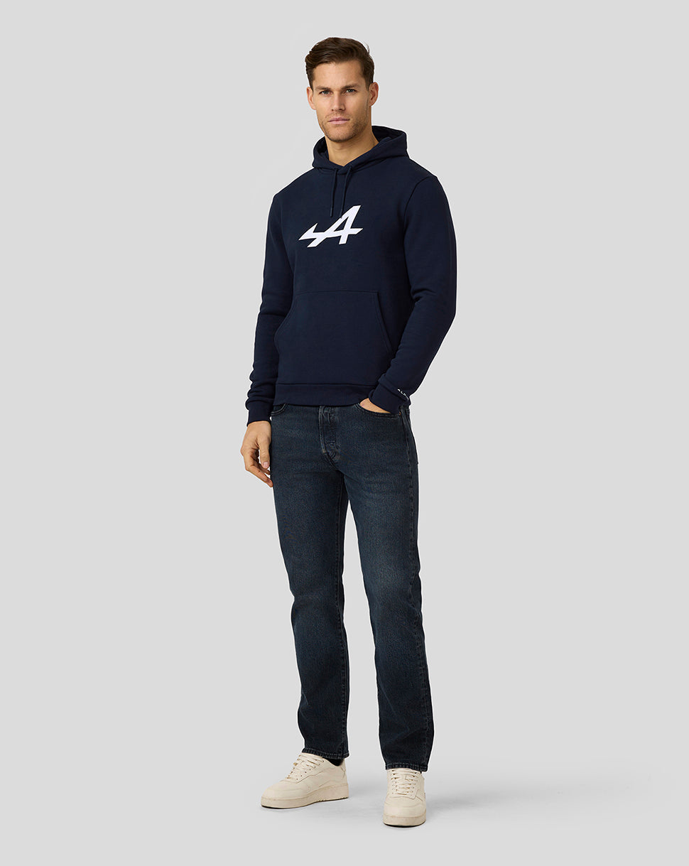 Male model in navy Alpine Core Essentials Hoodie with large center chest logo and drawcord hood