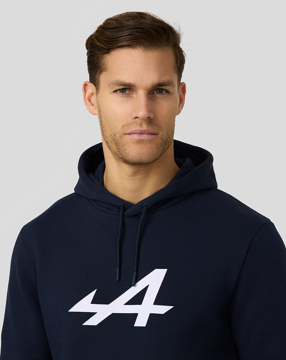 Man wearing navy Alpine Core Essentials Hoodie with a prominent white 44 logo on the chest