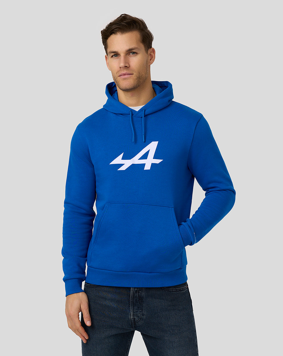 Male model wearing lapis blue Alpine hoodie with large white chest logo and front pocket