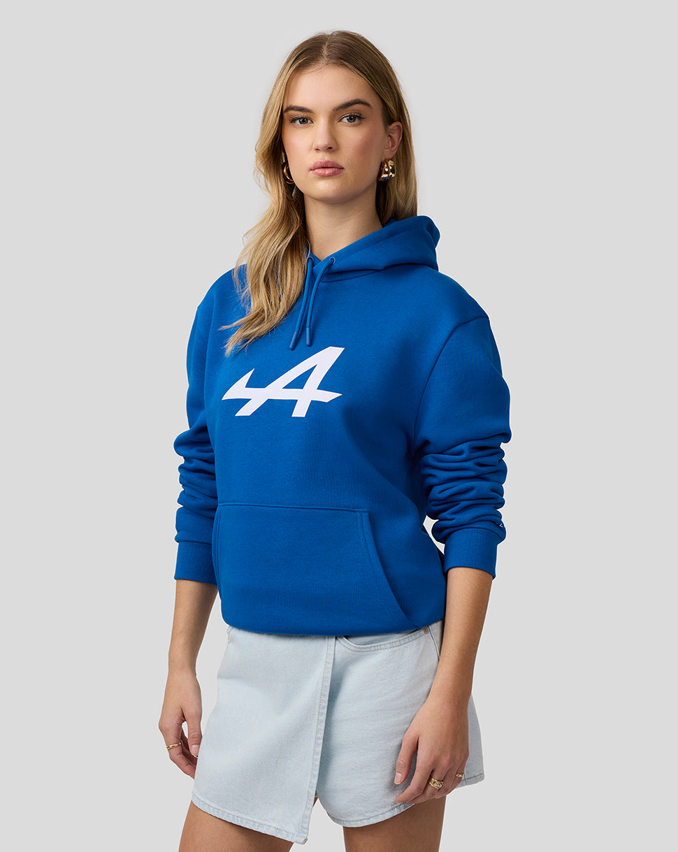Female model wearing lapis blue Core Essentials Hoodie with a white 44 logo on the chest, drawstring hood and front kangaroo pocket