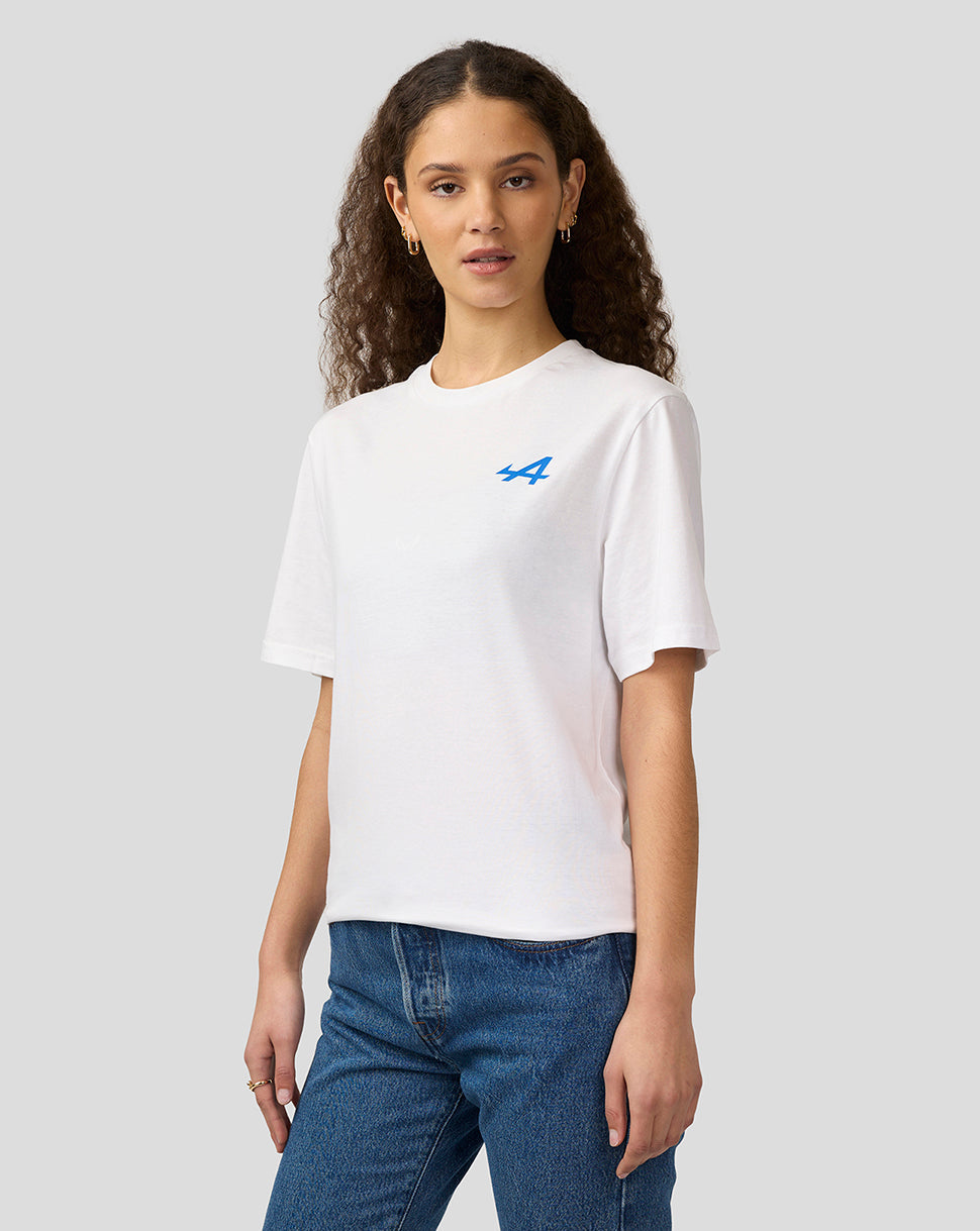 Female model wearing a white Alpine Unisex Graphic T-Shirt with a small blue logo on the left chest
