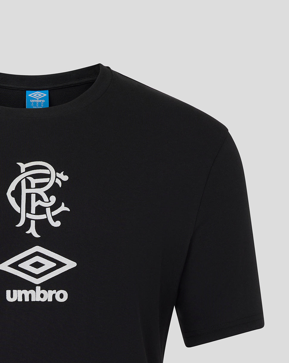Front close-up of black Rangers tee showing white monogram crest and Umbro diamond logo on chest.