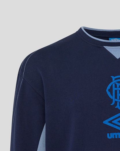 Shoulder close-up of navy Rangers travel crew sweat showing seam stitching and light blue neckline trim